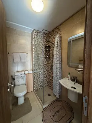 a bathroom with a toilet and a shower and a sink at Charming Appartment in Gueliz in Marrakech