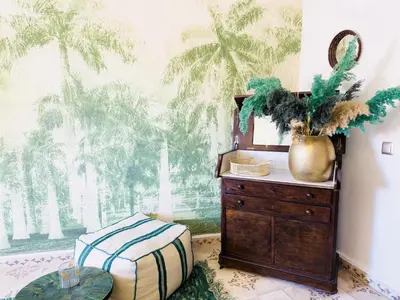a bedroom with a dresser with a mirror and a plant at Riad & Spa Stella Cadente Marrakech in Marrakech