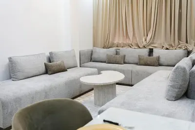 a living room with a couch and a table at Golden Skyline – Marrakech in Marrakech