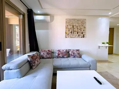 a living room with a couch and a table at Cosy Hyper centre Bd Hassan 2 in Marrakech