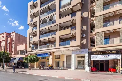 an apartment building on the corner of a street at NEW! Plein Gueliz, wifi, terrasse in Marrakech