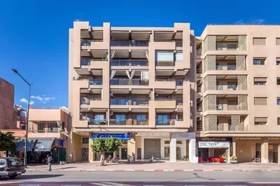 a large apartment building on a city street at New! Appartement en plein centre ville in Marrakech