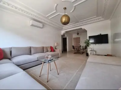 a living room with a couch and a table at Majorel Blue in Marrakech