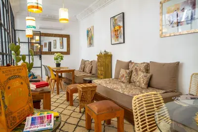 a living room with a couch and a table at Riad Bab Aljana in Marrakech