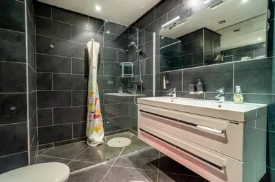 a bathroom with a sink and a toilet at Appartement Haut standing Gueliz Plaza in Marrakech