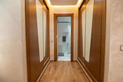 a hallway with two mirrors and a bathroom at Riad Gardens Two Bedroom Apartment in Marrakech
