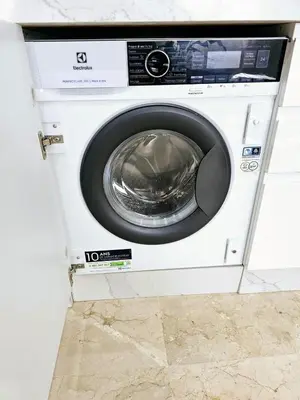 a washing machine with its door open in a room at Coeur de Marrakech : Luxe, ciné & confort in Marrakech