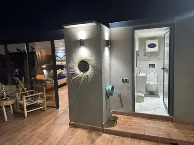 a room with a bathroom with a toilet in it at Appartement Luxueux au Rooftop à Guéliz in Marrakech