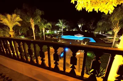 a view of a swimming pool at night at Villa Malika Silvana in Marrakech