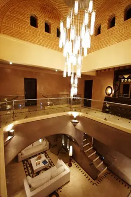 a large lobby with a chandelier in a building at Villa Malika Silvana in Marrakech