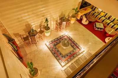 an overhead view of a living room with a table and chairs at Riad Dar Arwa in Marrakech