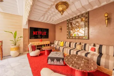 a living room with a couch and a table at Riad Dar Arwa in Marrakech