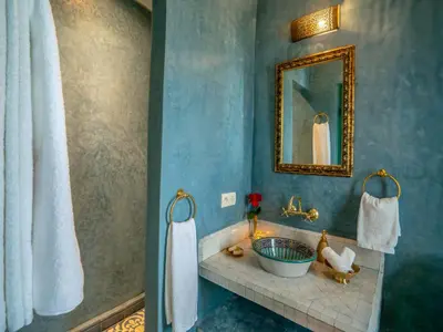 a bathroom with a sink and a mirror at Riad dada Messouda spa in Marrakech