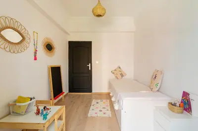a living room with a couch and a table at Appartement centre Marrakech gueliz - Cool & Cozy Apartment for a Family Stay in the Heart of the City in Marrakech