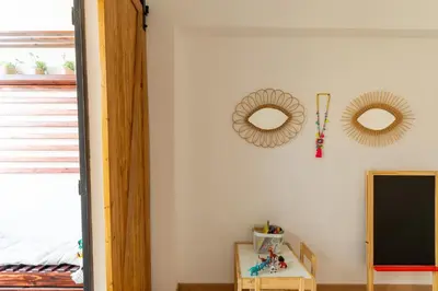 a room with two mirrors on the wall at Appartement centre Marrakech gueliz - Cool & Cozy Apartment for a Family Stay in the Heart of the City in Marrakech
