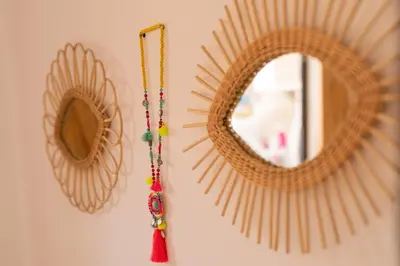 a mirror and a necklace hanging on a wall at Appartement centre Marrakech gueliz - Cool & Cozy Apartment for a Family Stay in the Heart of the City in Marrakech