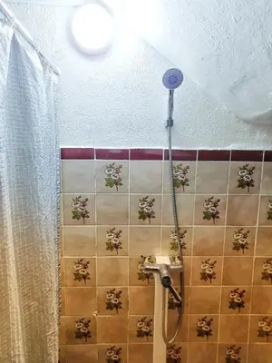 a bathroom with a shower with a shower head at Riad Le Petit Cactus -Familial et Privatif- in Marrakech