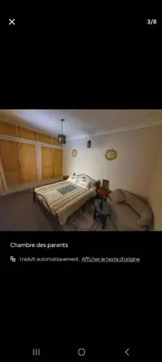 a picture of a bedroom with a bed and a desk at Riad Le Petit Cactus -Familial et Privatif- in Marrakech