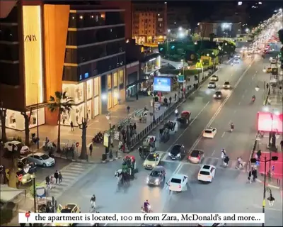 an image of a busy city street at night at Appartement luxueux avec vue panoramique sur l’Atlas au centre de Marrakech in Marrakech