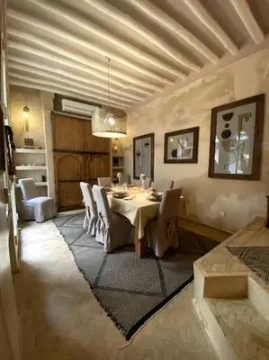 a dining room with a table and chairs at Riad Kismet Marrakech in Marrakech