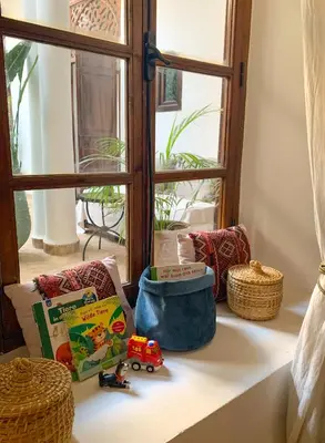 a window sill with books and toys on it at NOSADE Venue in Marrakech