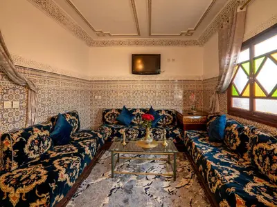 a living room with a couch and a table at Pretty Apartment in the Medina 2 in Marrakech