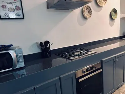 a kitchen with a stove and a counter top at Loft Marrakech 5 min du centre super emplacement in Marrakech