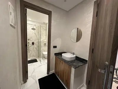 a bathroom with a sink and a toilet and a shower at Résidence Joudad Guéliz in Marrakech