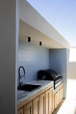 a kitchen with a sink and a counter top at Villa Ayani in Marrakech
