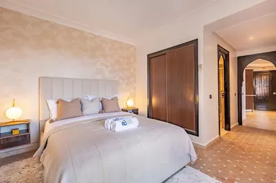 a bedroom with a large bed in a room at New, Appartement Miramas à Gueliz,en plein centre ville in Marrakech