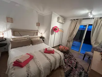 a bedroom with a bed with two towels on it at Loft Gueliz in Marrakech