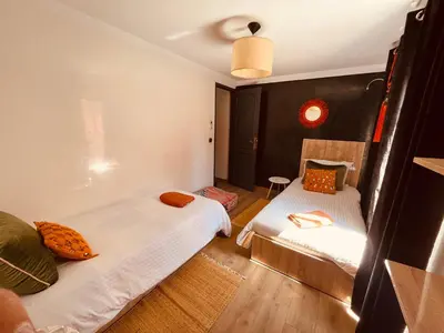 a room with two beds in a room with at Loft Gueliz in Marrakech
