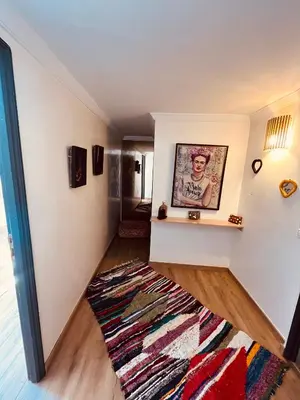 a living room with a rug on the floor at Loft Gueliz in Marrakech