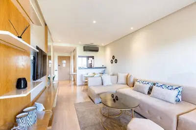 a living room with a couch and a table at PO 10 Appartement de luxe, golf, piscine & club house in Marrakech