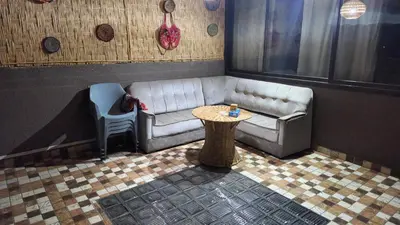 a living room with a couch and a table at Riad marrakech boujloud in Marrakech