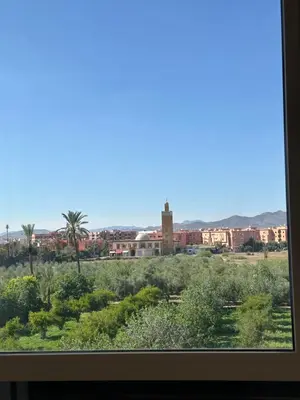 a view of a city from a window at Appartement Zazat in Marrakech