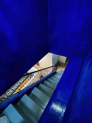 a blue stair case with a blue wall and blue stairs at Medina Oasis Hostel in Marrakech
