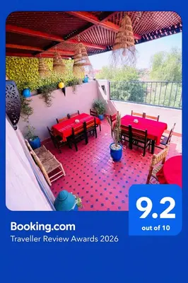 avisor picture of a patio with red tables and chairs at Al Bahja family in Marrakech