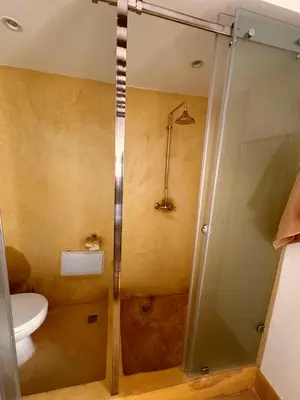 a bathroom with a shower and a toilet in it at Little 24 in Marrakech