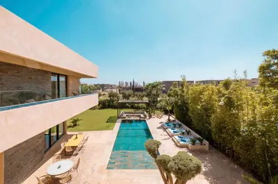 an overhead view of a swimming pool in a building at Villa Hicham Golf Marrakech in Marrakech