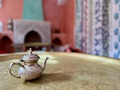 a tea pot sitting on top of a table at Riad Flottement Des Songes in Marrakech