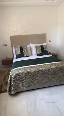 a bedroom with a large bed in a room at appartement à Gueliz in Marrakech