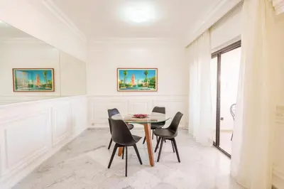 a dining room with a table and chairs at Luxury Place M Avenue in Marrakech
