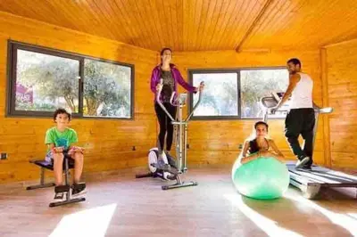 a group of people in a room with a gym at Appart Premium Village Marrakech in Marrakech