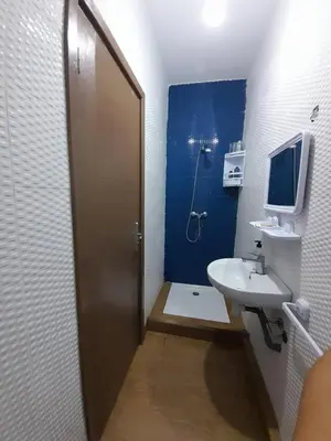 a bathroom with a sink and a toilet and a shower at Chill Apartment Portes Gueliz in Marrakech
