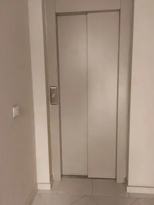 a white elevator in a room with a door at Chill Apartment Portes Gueliz in Marrakech