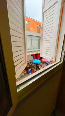 an open window with a toy in a sandbox at Residence Koutoubienne in Marrakech