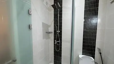 a bathroom with a glass shower with a toilet at Marrakech 2 Bedroom Family Apartment in Marrakech