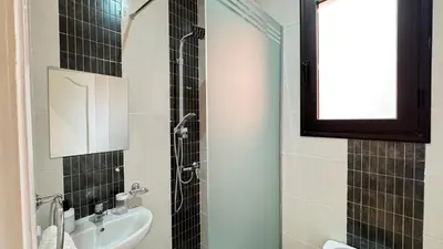 a bathroom with a sink and a shower at Marrakech 2 Bedroom Family Apartment in Marrakech