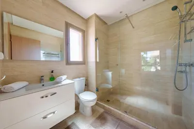 a bathroom with a toilet and a shower and a sink at Green Side Golf 3 B.R Apartment in Marrakech